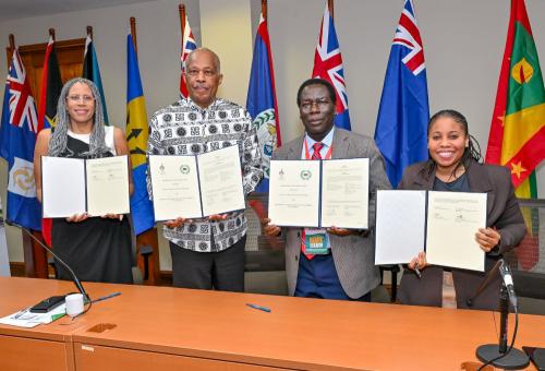 Ms Sandrea Maynard, Pro Vice-Chancellor, Global Affairs, The UWI; Professor Sir Hilary Beckles, Vice-Chancellor, The UWI; Professor Andrew Haruna, Secretary General, CVCNU; and Dr Sylverina Olaghere, Assistant Secretary-General, Projects, Programmes and Training, CVCNU, display the signed MOU.