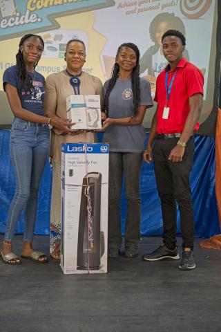 Mrs. Althea Wood, Deputy Principal of The St. Michael School, and students receive the prize, sponsored by Kooyman Barbados, for the secondary school with the second-highest participation.