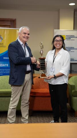 3.	Professor R. Clive Landis, Pro Vice-Chancellor and Principal of The UWI Cave Hill Campus, presents the Vice-Chancellor’s Award for Academic Excellence to Nicole Valencia at the inaugural IUSLCEE.