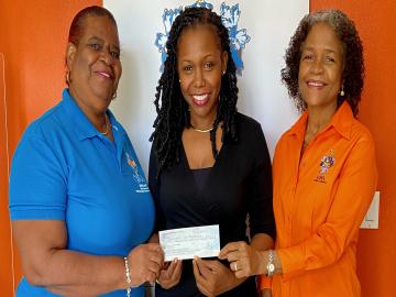 1.	Mrs. Celestine John and Dr. Phyllis Fleming-Banks handing over Cheque to Commissioner Lauraine Gumbs